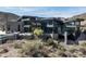 Back of a modern luxury desert home with an infinity pool and mountain views at 9643 E Cintarosa Pass, Scottsdale, AZ 85262