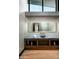 Modern powder room featuring a vessel sink on a blue countertop and a large mirror at 9643 E Cintarosa Pass, Scottsdale, AZ 85262