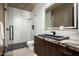Modern bathroom featuring elegant finishes, vanity with a sink, walk-in shower with sleek fixtures at 9643 E Cintarosa Pass, Scottsdale, AZ 85262