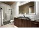 Modern bathroom featuring elegant finishes, vanity with a sink, walk-in shower with sleek fixtures at 9643 E Cintarosa Pass, Scottsdale, AZ 85262