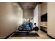 Bright exercise room with exercise machines and sliding doors to the exterior at 9643 E Cintarosa Pass, Scottsdale, AZ 85262