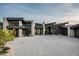 Stunning modern home with stone accents and a spacious driveway at 9643 E Cintarosa Pass, Scottsdale, AZ 85262