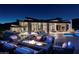 Backyard fire pit area with comfortable seating, perfect for entertaining with a modern home backdrop at 9643 E Cintarosa Pass, Scottsdale, AZ 85262