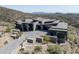 Contemporary luxury home with stone, desert landscaping and private driveway at 9643 E Cintarosa Pass, Scottsdale, AZ 85262