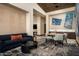 Modern living room featuring contemporary furnishings, stylish decor, and wet bar, creating a comfortable and inviting atmosphere at 9643 E Cintarosa Pass, Scottsdale, AZ 85262