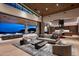 Expansive living room featuring an open floorplan and outdoor views with elegant hardwood floors at 9643 E Cintarosa Pass, Scottsdale, AZ 85262