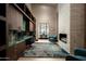 Contemporary office features a fireplace, mountain views, a built-in desk, and sleek, modern decor at 9643 E Cintarosa Pass, Scottsdale, AZ 85262