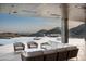Inviting covered patio with views, pool, and seating area at 9643 E Cintarosa Pass, Scottsdale, AZ 85262