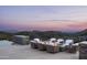 Comfortable patio seating area with fire pit and open desert view at 9643 E Cintarosa Pass, Scottsdale, AZ 85262