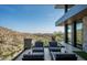 Outdoor patio area with comfortable seating and beautiful desert views at 9643 E Cintarosa Pass, Scottsdale, AZ 85262