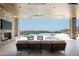 Elegant covered patio with TV, fireplace, comfortable seating and a view at 9643 E Cintarosa Pass, Scottsdale, AZ 85262