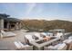 Desert home featuring an outdoor fire pit with mountain views and pool at 9643 E Cintarosa Pass, Scottsdale, AZ 85262