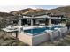 Luxury home boasts an infinity pool, comfortable lounge areas, and mountain views at 9643 E Cintarosa Pass, Scottsdale, AZ 85262