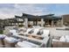 Luxury home features comfortable outdoor seating around a fire pit and gorgeous mountain views at 9643 E Cintarosa Pass, Scottsdale, AZ 85262