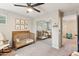 Bedroom room with crib, rocking chair, decor and mirrored closet at 10220 E Isleta Ave, Mesa, AZ 85209