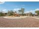 A community featuring a playground, covered pavilion and sidewalks under a clear blue sky at 10220 E Isleta Ave, Mesa, AZ 85209