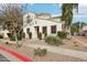 Charming stucco home with well-maintained landscaping and American flag at 10220 E Isleta Ave, Mesa, AZ 85209