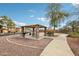 Community park featuring a covered picnic area with stone pillars and a nearby playground at 10220 E Isleta Ave, Mesa, AZ 85209