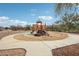 Community playground with climbing equipment, slide, and sandy base, perfect for ' enjoyment at 10220 E Isleta Ave, Mesa, AZ 85209