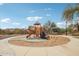 Community playground featuring a slide, climbing structure, and soft sand for safe play at 10220 E Isleta Ave, Mesa, AZ 85209