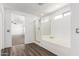 Bright bathroom with tub and shower and hard surface flooring at 11856 W Grant St, Avondale, AZ 85323