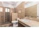 A luxurious bathroom with designer tile and modern fixtures at 11856 W Grant St, Avondale, AZ 85323