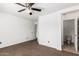 A spacious bedroom featuring a ceiling fan and an en-suite bathroom at 11856 W Grant St, Avondale, AZ 85323