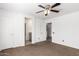 Open Primary bedroom featuring a ceiling fan and attached bath at 11856 W Grant St, Avondale, AZ 85323