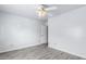 Cozy room with a light gray wood floor and light gray walls at 11856 W Grant St, Avondale, AZ 85323