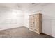 Walk-in closet with shelving units and a dresser at 11856 W Grant St, Avondale, AZ 85323