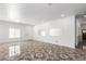 Large living room boasting tile flooring, white walls, recessed lighting, and an open layout at 11856 W Grant St, Avondale, AZ 85323