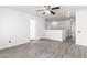 Bright living room with neutral walls and modern light gray flooring at 11856 W Grant St, Avondale, AZ 85323