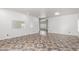 Bright living room featuring decorative tile flooring, recessed lighting, and neutral paint at 11856 W Grant St, Avondale, AZ 85323
