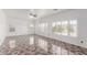 Bright, airy living room with decorative tile floor and plantation shutters at 11856 W Grant St, Avondale, AZ 85323