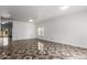 Spacious living room featuring tile flooring, white walls, and an open view at 11856 W Grant St, Avondale, AZ 85323