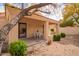 Covered back patio featuring a dining set and desert landscaping creating a relaxing outdoor space at 12244 N Tower Dr, Fountain Hills, AZ 85268