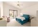 Comfortable bedroom with ceiling fan, sliding glass door, and light neutral tones at 12244 N Tower Dr, Fountain Hills, AZ 85268