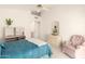 Bright bedroom with comfortable seating, white furniture, and neutral carpeting at 12244 N Tower Dr, Fountain Hills, AZ 85268