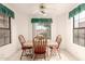 Cozy dining area with wood table, chairs, and window views at 12244 N Tower Dr, Fountain Hills, AZ 85268
