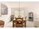 Charming dining room with wooden table set, chandelier lighting, and view into the kitchen at 12244 N Tower Dr, Fountain Hills, AZ 85268