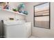 Bright laundry room with essential appliances and a window, for added convenience and ventilation at 12244 N Tower Dr, Fountain Hills, AZ 85268