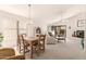 Open-concept living area connects dining and living spaces, featuring a fireplace and sliding glass doors at 12244 N Tower Dr, Fountain Hills, AZ 85268
