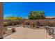 Beautiful backyard with desert landscaping, a brick paver patio, and an outdoor seating area at 13641 W Jesse Red Dr, Peoria, AZ 85383
