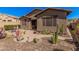 Backyard featuring desert landscaping, a brick paver patio, and a seating area at 13641 W Jesse Red Dr, Peoria, AZ 85383