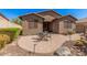 Backyard featuring desert landscaping, a brick paver patio, and outdoor seating at 13641 W Jesse Red Dr, Peoria, AZ 85383