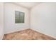 Bedroom featuring neutral colors, tile floor, a window and base molding at 13641 W Jesse Red Dr, Peoria, AZ 85383