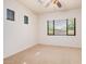 Bedroom with a large window and a ceiling fan, offering a bright and airy feel at 13641 W Jesse Red Dr, Peoria, AZ 85383
