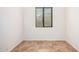 Bedroom featuring neutral colors, tile floor, a window and base molding at 13641 W Jesse Red Dr, Peoria, AZ 85383