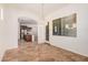 Open dining room features tile floors, modern chandelier and an open view at 13641 W Jesse Red Dr, Peoria, AZ 85383