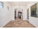 Open dining room features tile floors and a view into the kitchen at 13641 W Jesse Red Dr, Peoria, AZ 85383